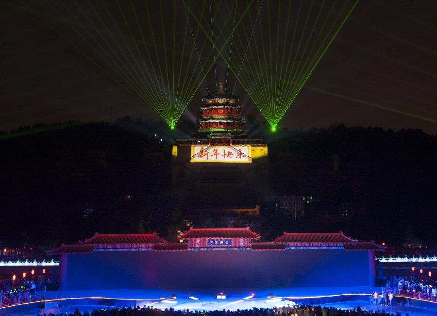 A lightshow illuminates the Summer Palace during a new year countdown event at the Summer Palace in Beijing. Jan. 1, 2013. (Xinhua/Zhang Yu) 
