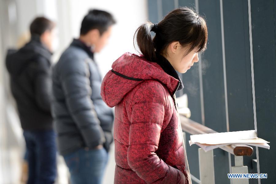 Students prepare for the upcoming National Entrance Examination for Postgraduate (NEEP) at a corridor in Anhui University in Hefei, capital of east China's Anhui Province, Dec. 30, 2012. Examinees taking the NEEP scheduled on Jan. 5 have rocketed up to 1.8 million this year, hitting an all-time high. (Xinhua/Zhang Rui) 