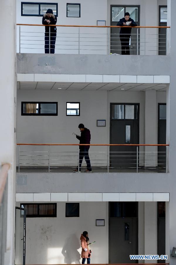 Students prepare for the upcoming National Entrance Examination for Postgraduate (NEEP) at corridors in Anhui University in Hefei, capital of east China's Anhui Province, Dec. 30, 2012. Examinees taking the NEEP scheduled on Jan. 5 have rocketed up to 1.8 million this year, hitting an all-time high. (Xinhua/Zhang Rui)