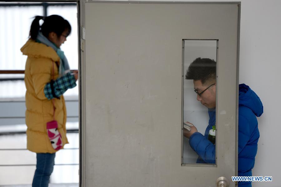 Students prepare for the upcoming National Entrance Examination for Postgraduate (NEEP) at a corridor in Anhui University in Hefei, capital of east China's Anhui Province, Jan. 3, 2013. Examinees taking the NEEP scheduled on Jan. 5 have rocketed up to 1.8 million this year, hitting an all-time high. (Xinhua/Zhang Rui) 