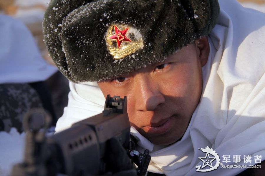 In late December 2012, a garrison regiment conducts a drill deep in the Greater Hinggan mountains of Heilongjiang province. The soldiers went through many hard exercises although the temperature dipped to 40 degrees Celsius below zero. (Photo/ reader.chinamil.com.cn)