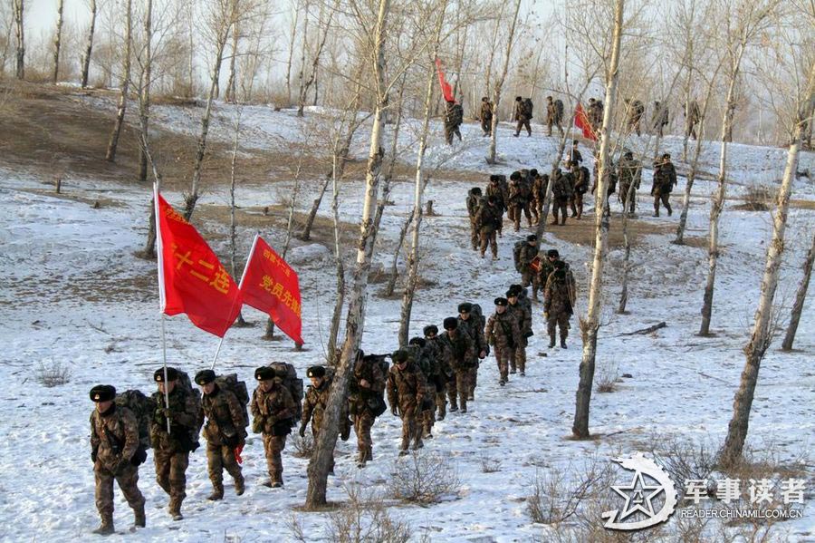In late December 2012, a garrison regiment conducts a drill deep in the Greater Hinggan mountains of Heilongjiang province. The soldiers went through many hard exercises although the temperature dipped to 40 degrees Celsius below zero. (Photo/ reader.chinamil.com.cn)