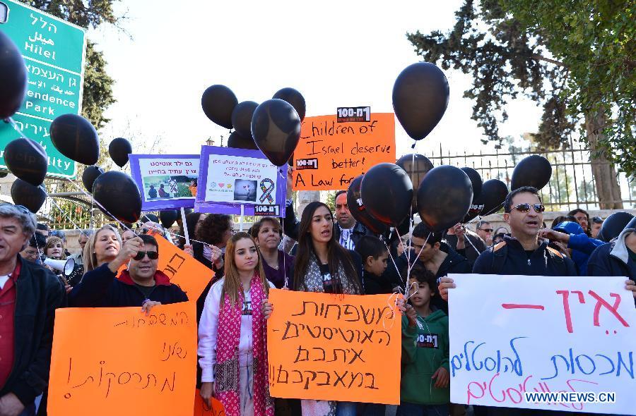 Israelis rally in protest of shrinking government funding for children with autism in Jerusalem, on Jan. 4, 2013. According to the data published by the Ministry of Welfare and Social Affairs, every one in 100 babies born in Israel suffers from autism. In addition, the data revealed that since 2000 the number of children registered with the ministry as suffering from autism has multiplied by no less than 50 times, from 156 in 2000 to 7,899 in 2012. However, the budget in the ministry allocated to helping people with autism only increased by 9.5 throughout this period. (Xinhua/Yin Dongxun)