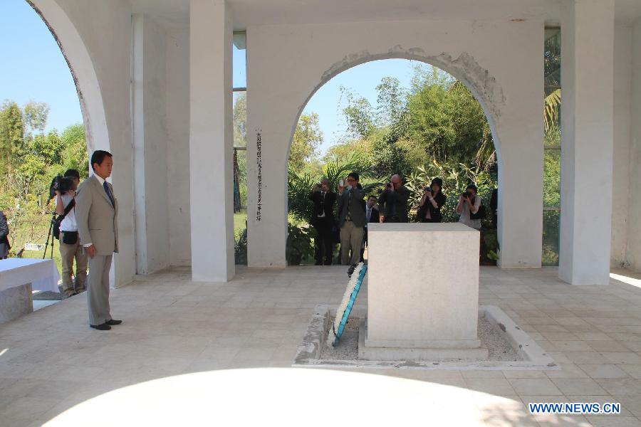 Japanese Deputy Prime Minister and Finance Minister Taro Aso (2nd L) visits the War Cemetery in Yangon, Myanmar, Jan. 4, 2013. Japanese Deputy Prime Minister and Finance Minister Taro Aso's visit to the War Cemetery in Yangon's suburban area Friday has raised protests by some war veterans who experienced the Japanese aggressive war in Myanmar. (Xinhua/U Aung) 