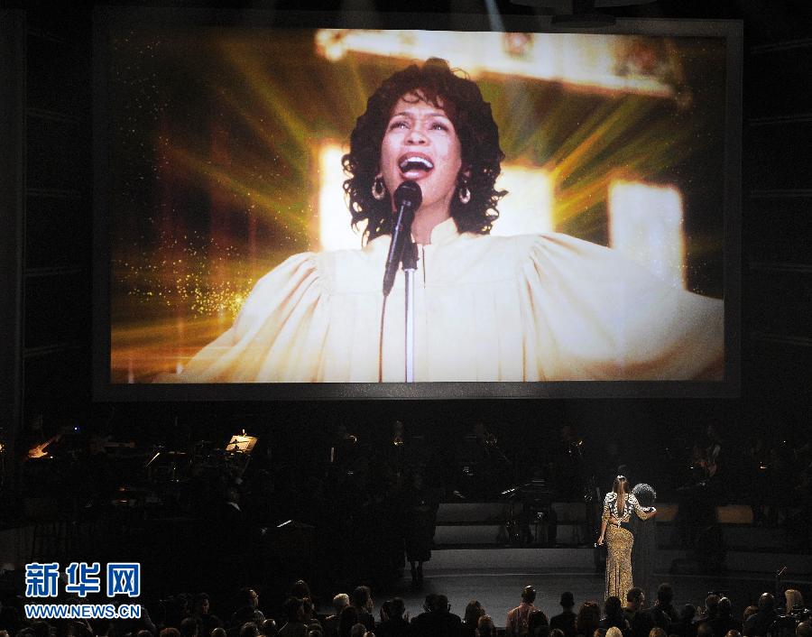 Photos of Whitney Houston were displayed on the big screen during the performances. (Xinhua Photo)