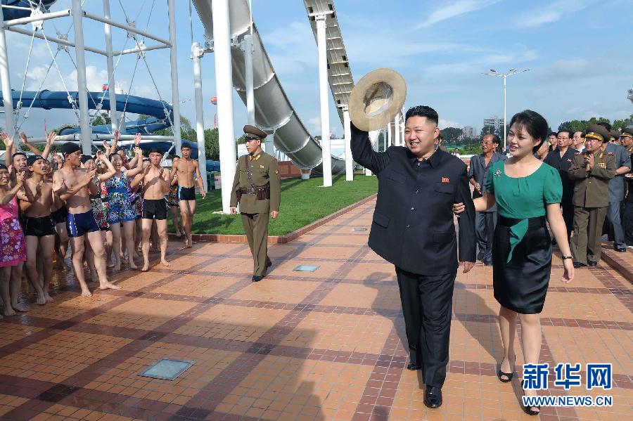 DPRK’s top leader Kim Jong-un attends the completion ceremony of the Rungna People's Pleasure Ground, a new amusement park in Pyongyang, with his wife Ri Sol-ju, July 25, 2012. (Xinhua/KCNA)