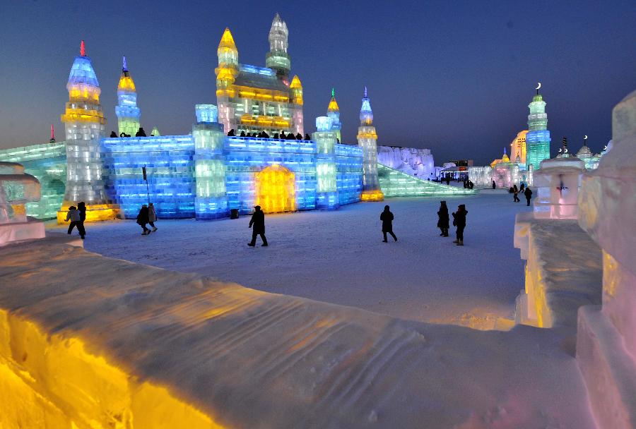 Visitors walk around in the Ice and Snow World during the 29th Harbin International Ice and Snow Festival in Harbin, capital of northeast China's Heilongjiang Province, Jan. 5, 2013. The festival kicked off on Saturday. (Xinhua/Wang Jianwei)