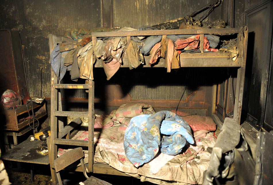 A photo taken on Jan. 4 shows the messy inside of a private orphanage damaged by fire, which claims four children’s lives in Lankao county, Henan province. (Xinhua/Zhu Xiang)