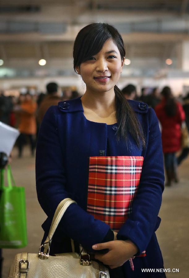 Zhang Xiaoxue, a 23-year-old graduate from the Renmin University of China who is majored in Administration Management, is seen at a job fair for postgraduates in Beijing, capital of China, Jan. 6, 2013. Zhang took part in the National Public Servant examination in November last year. She wants to do administrative work at public institutes with a starting salary no less than 5,000 yuan (about 803 U.S. dollars) per month. (Xinhua/Wan Xiang)  