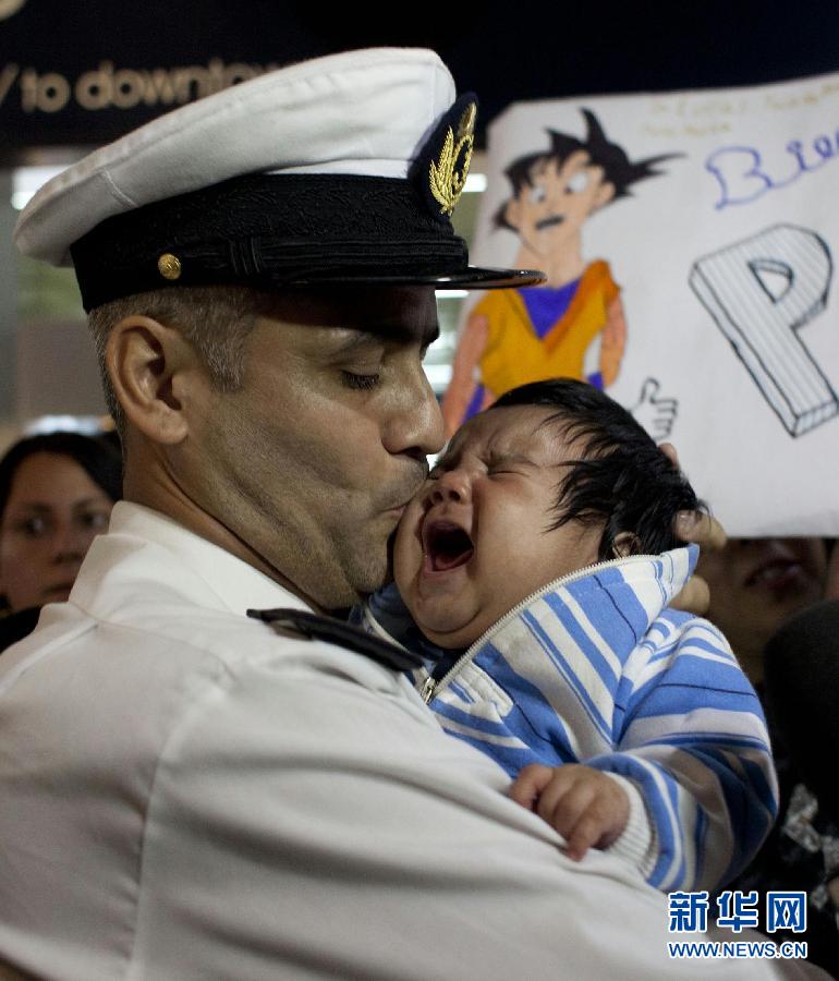 Crew members of the Argentine Navy frigate the Libertad arrive at the Buenos Aires international airport to reunite with their families. The Libertad has been checked and detained by the judicial department in the port of Tema (Ghana) on Oct. 2, 2012. (Xinhua/Martin Zabala)