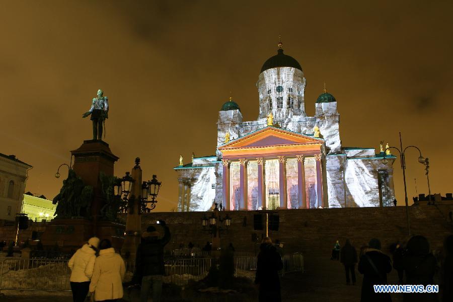 A cathedral is illuminated on the senate square in Helsinki, capital of Finland, on Jan. 6, 2013. Epiphany is celebrated here with an art slide show. (Xinhua/Li Jizhi)