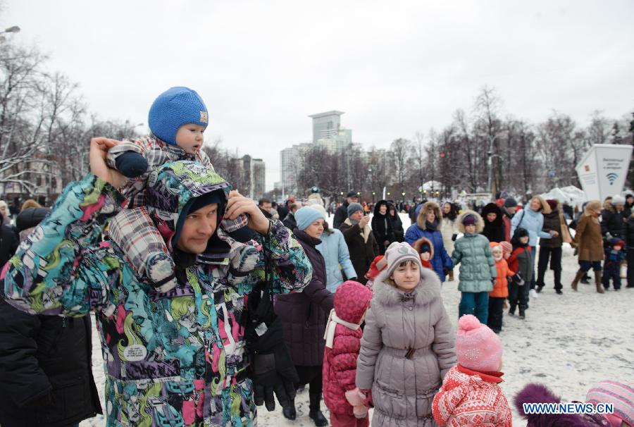 Peope take part in a celebration on Orthodox Christmas celebration at Sokolniky Park of Moscow, capital of Russia, on Jan. 7, 2013. Church services took place across Russia from Sunday to Monday to mark the Orthodox Christmas, with thousands of people attending ceremonies to celebrate the holiday. In accordance with the Julian calendar which was introduced by Julius Caesar in 45 B.C., the Orthodox Christmas takes place on Jan. 7, 13 days after the Western Christmas. (Xinhua/Jiang Kehong) 