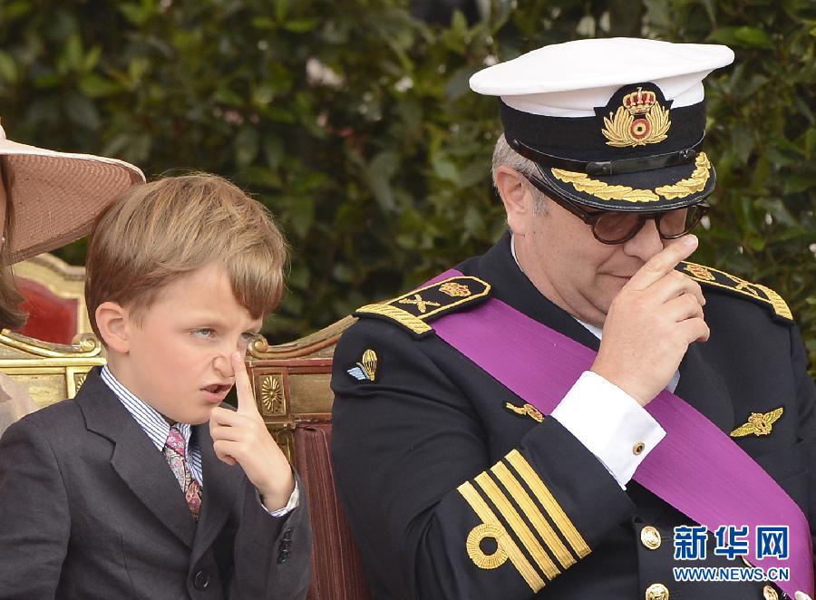 Belgian Prince Nicolas (L) and his father Prince Laurent watch the military parade in Brussels, capital of Belgium, July 21, 2012, on the occasion of the Belgian National Day. (Xinhua/Wu Wei)