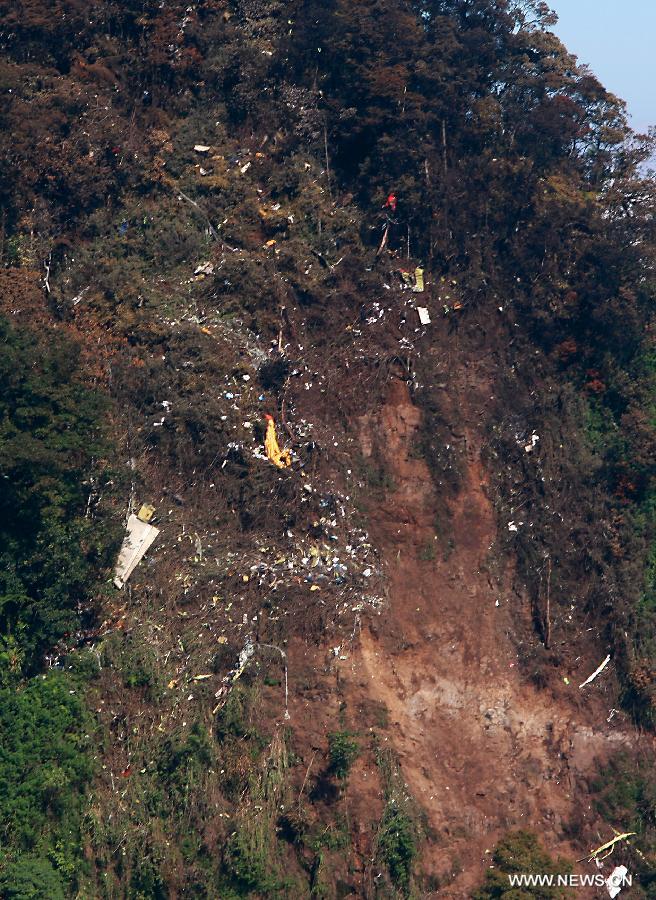Debris of the crashed Russian-made Sukhoi super jet-100 scatter on the slope of the Mount Salak in Bogor, West Java, Indonesia, May 11, 2012. (Xinhua/Veri Sanovri)