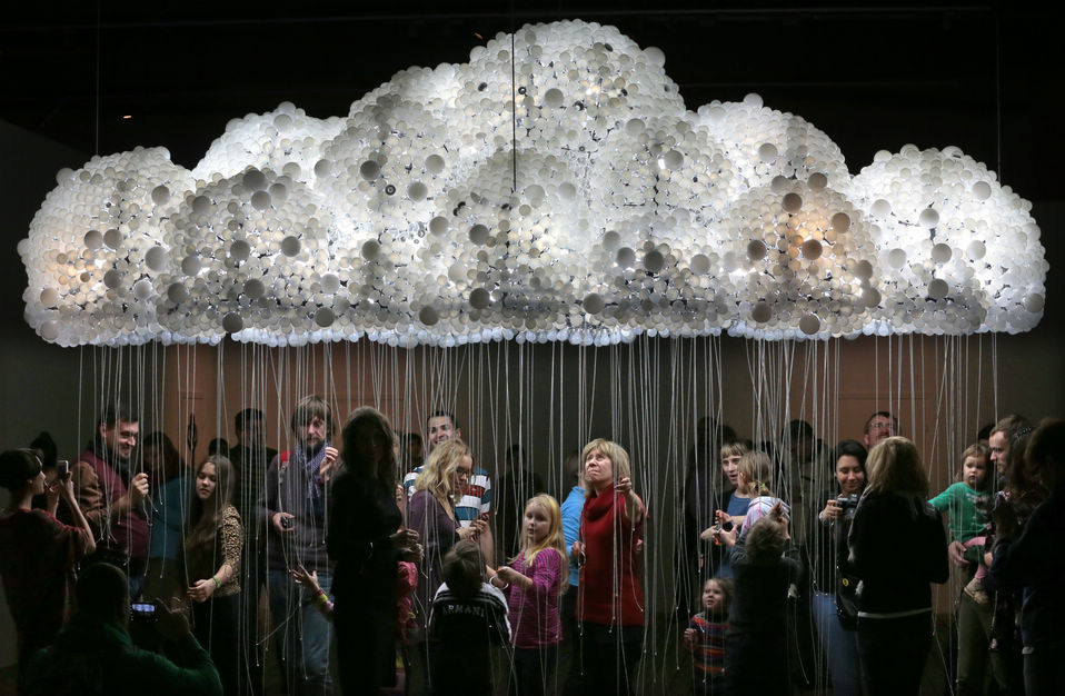 Visitors look at an exhibit during the opening of "Art Experiment" exhibition at Garage Center for Contemporary Culture’s in Moscow's Gorky Park, Russia, Jan. 2, 2013. The exhibition is sponsored by the British Council. (Xinhua/AP)