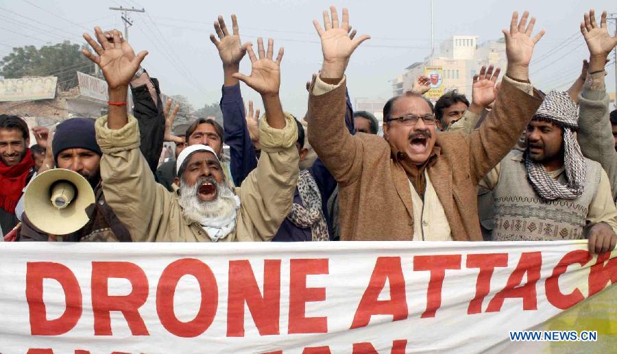 People shout slogans during a protest rally against US drone strikes in central Pakistan's Multan on Jan. 8, 2013. At least eight people were killed and four others injured in two separate U.S. drone strikes launched in the wee hours of Thursday morning, according to local media reports. (Xinhua Photo/Stringer) 