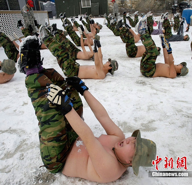 South Korean primary and secondary school students have military training in snow without shirts in a boot camp in Daebu, Ansan, South Korea, Dec. 27, 2010. (Photo/Chinanews.com)