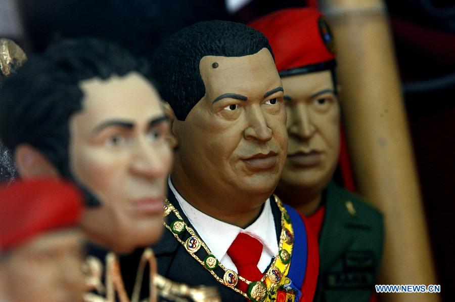 A figure of Venezuelan President Hugo Chavez (C) is displayed for sale in a store in Caracas, capital of Venezuela, on Jan. 9, 2013. Venezuela's Supreme Court on Wednesday upheld the government's decision to delay the inauguration of ailing President Hugo Chavez, who is recovering from surgery in Havana, Cuba. (Xinhua/Juan Carlos Hernandez)