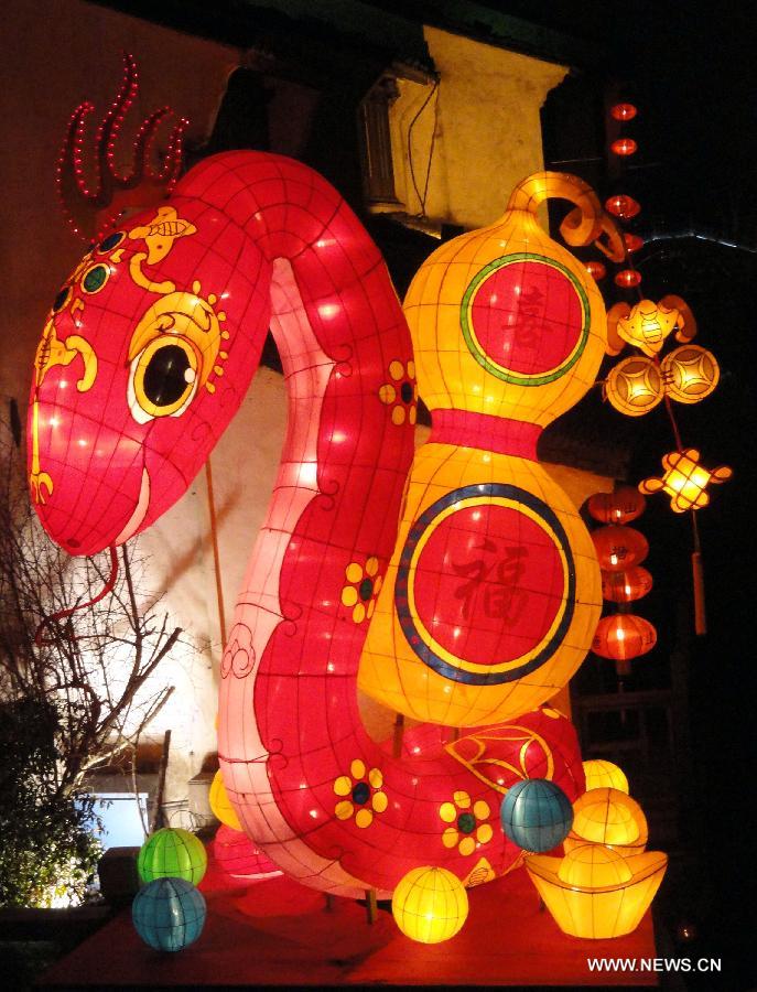 Photo taken on Jan. 9, 2013 shows a colored lantern in the shape of a tree at a square in Suzhou, east China's Jiangsu Province. Various colored lanterns were decorated in Suzhou to greet the upcoming Spring Festival, which falls on Feb. 10 this year. (Xinhua/Wang Jiankang)