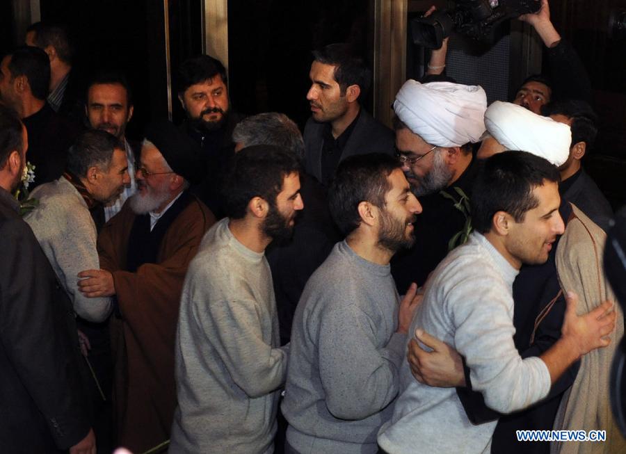 Released Iranian hostages are welcomed upon his arrival at the Sheraton Hotel in Damascus, Syria, Jan. 9, 2013. As many as 2,130 people were released from Syrian prisons in exchange of 48 kidnapped Iranians, a Turkish human rights activist told Xinhua Wednesday. In last August, a total of 48 Iranians were abducted by Syrian rebels in Damascus. Iran claimed them to be pilgrims, while the Syrian rebels alleged that they were Iranian military officials in Syria. (Xinhua/Bassem Tellawi)