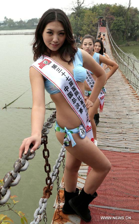 A contestant of the 37th Miss Bikini International Competition poses for a photo in Qixingyan scenery spot in Zhaoqing, south China's Guangdong Province, Jan. 10, 2013. The China final of the competition kicked off here on Jan. 9. (Xinhua/Li Mingfang)
