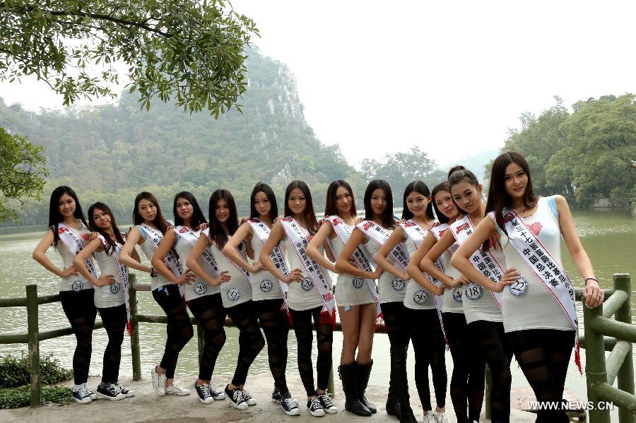 Contestants of the 37th Miss Bikini International Competition pose for a photo in Qixingyan scenery spot in Zhaoqing, south China's Guangdong Province, Jan. 10, 2013. The China final of the competition kicked off here on Jan. 9. (Xinhua/Li Mingfang)