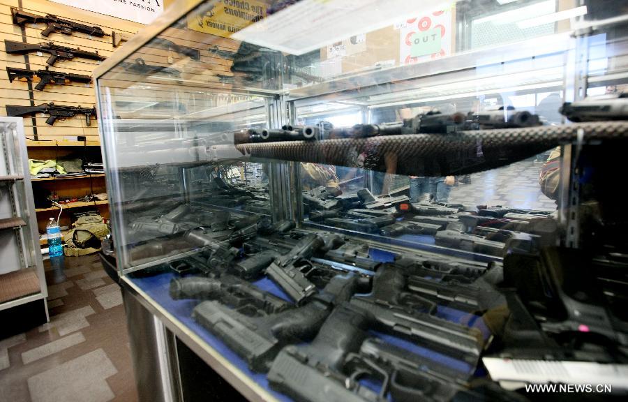 Guns are displayed at a gun shop in Chantilly, Virginia, the United States, on Jan. 10, 2013. U.S. Vice President Joe Biden said on Thursday he will present proposals of the White House gun-control task force to President Barack Obama by next Tuesday. (Xinhua/Fang Zhe) 