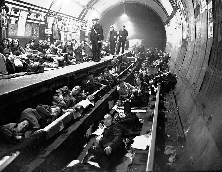 Londoners sleep on the platform and on the train tracks at Aldwych Underground station, London, during heavy all-night Nazi bombing raids, Oct. 8, 1940. (People's Daily Online/AP)