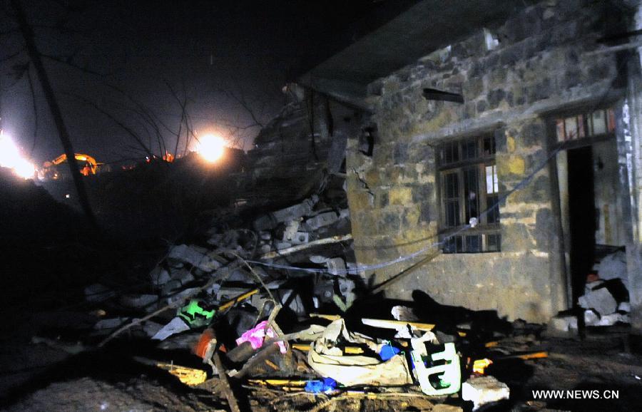 Photo taken on Jan. 11, 2013 shows a residential house at the landslide site at Gaopo Village in Zhenxiong County, southwest China's Yunnan Province. (Xinhua/Chen Haining)