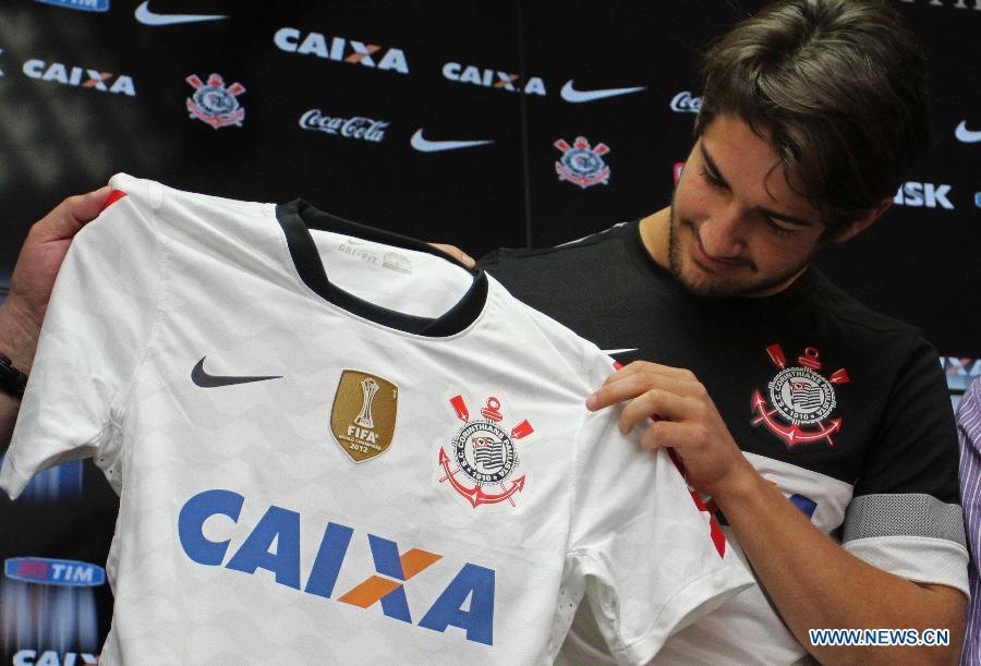Brazilian soccer player Alexandre Pato shows his new jersey during a press conference in Sao Paulo, Brazil, on Jan. 11, 2013. Pato, a former player of AC Milan, has been contracted to be a player of Brazilian soccer club Corinthians for 15 million euros, according to the local press. (Xinhua/Rahel Patrasso)