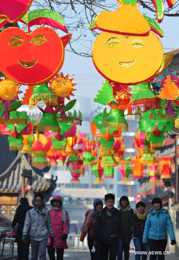 Visitors view lanterns displayed to greet the upcoming Spring Festival, which falls on Feb. 10 this year, in Zhoucun, east China's Shandong Province, Jan. 12, 2013. (Xinhua/Dong Naide) 