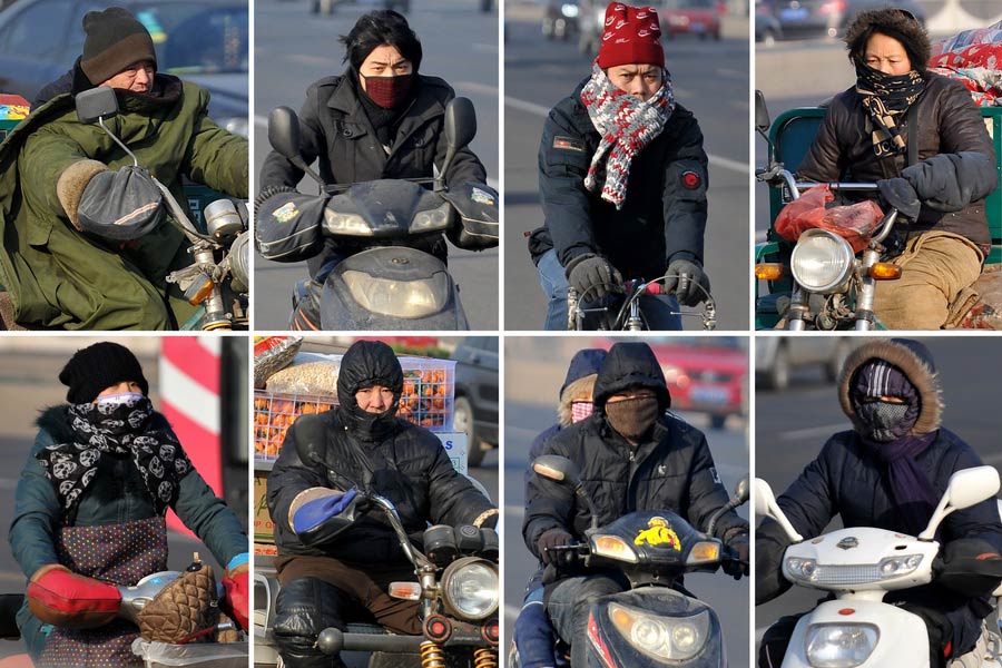 Taiyuan citizens brave the cold on Jan.5, 2013. The temperature in Taiyuan dropped down to minus 16 degrees centigrade on the day. (Xinhua/Zhan Yan).