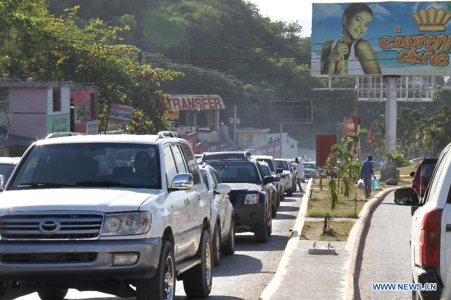 Vehicles drive on an avenue in the city of Port au Prince, capital of Haiti, on Jan. 12, 2013. Haitian President Michel Martelly called for patience from survivors on Saturday on the third anniversary of the 2010 earthquake that killed more than 200,000 people. (Xinhua/Zhu Qingxiang) 