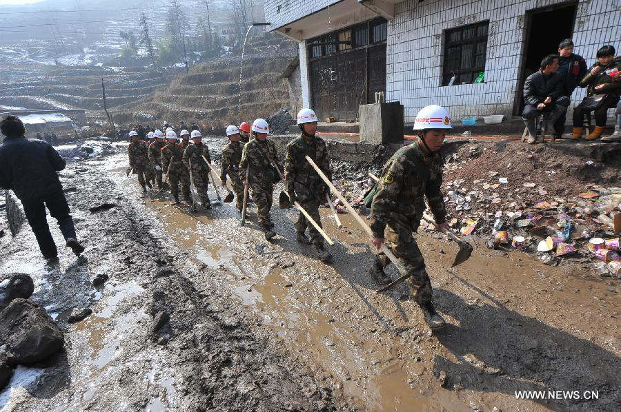 Rescuers leave a landslide spot in Zhenxiong mountain of Zhaotong City, southwest China's Yunnan Province, Jan. 12, 2012. The rescue of a landslide which hit the Zhaojiagou area of Gaopo Village early Friday finished after all 46 bodies were retrieved Saturday. (Xinhua/Chen Haining) 