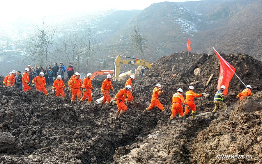 Rescuers leave a landslide spot in Zhenxiong mountain of Zhaotong City, southwest China's Yunnan Province, Jan. 12, 2012. The rescue of a landslide which hit the Zhaojiagou area of Gaopo Village early Friday finished after all 46 bodies were retrieved Saturday. (Xinhua/Chen Haining)