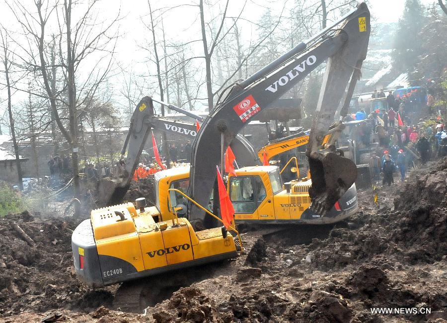 An excavator works at a landslide spot in Zhenxiong mountain of Zhaotong City, southwest China's Yunnan Province, Jan. 12, 2012. The rescue of a landslide which hit the Zhaojiagou area of Gaopo Village early Friday finished after all 46 bodies were retrieved Saturday. (Xinhua/Chen Haining) 