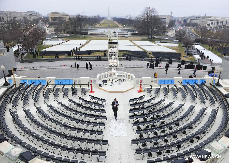 A staff checks the venue during a dress rehearsal of the 57th Presidential Inaugural ceremony on the West Steps of the U.S. Capitol in Washington D.C., capital of the United States, Jan. 13, 2013. U.S. President Barack Obama will be ceremonially sworn in for a second four-year term on January 21. (Xinhua/Zhang Jun) 