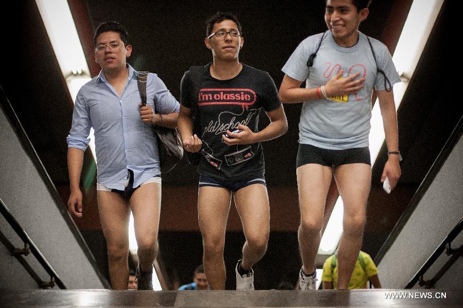 People without their pants take part in the worldwide "No Pants Subway Ride" event at a subway station in Mexico City, capital of Mexico, on Jan. 13, 2013. (Xinhua/Pedro Mera) 