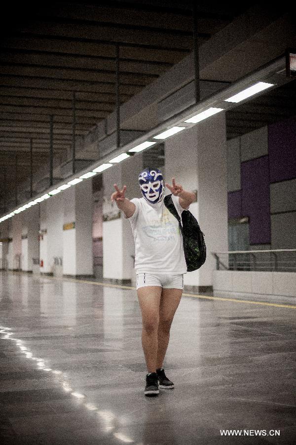 A man without pants takes part in the worldwide "No Pants Subway Ride" event at a subway station in Mexico City, capital of Mexico, on Jan. 13, 2013. (Xinhua/Pedro Mera) 
