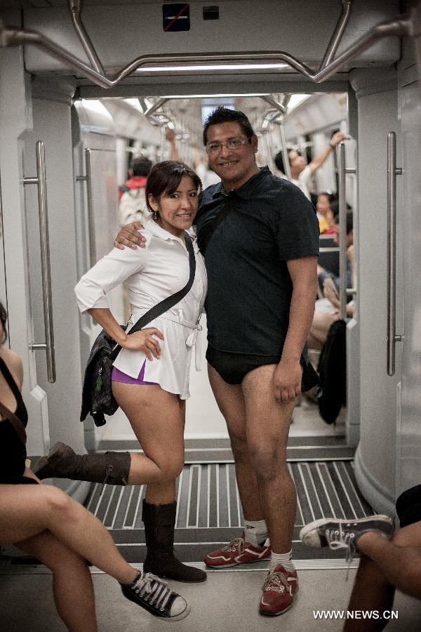 People without their pants take part in the worldwide "No Pants Subway Ride" event in a subway train in Mexico City, capital of Mexico, on Jan. 13, 2013. (Xinhua/Pedro Mera) 