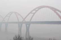Xiangjiang Bridge is seen amid dense fog in Changsha City