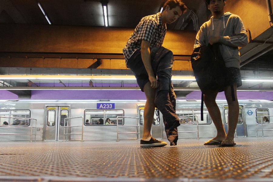 People take off their pants on a subway platform as they take part in the annual "No Pants Subway Ride" in Sao Paulo, Brazil, on Jan. 13, 2013. (Xinhua/Rahel Patrasso)