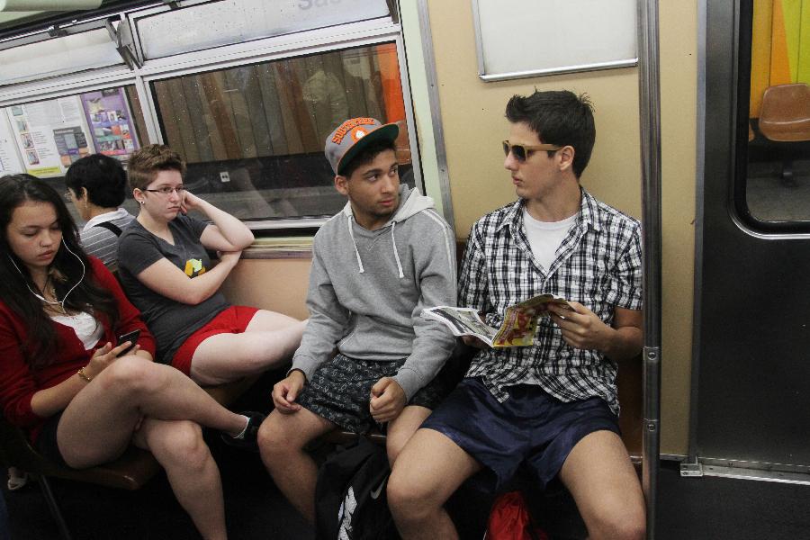 People without their pants take part in the annual "No Pants Subway Ride" in Sao Paulo, Brazil, on Jan. 13, 2013. (Xinhua/Rahel Patrasso)