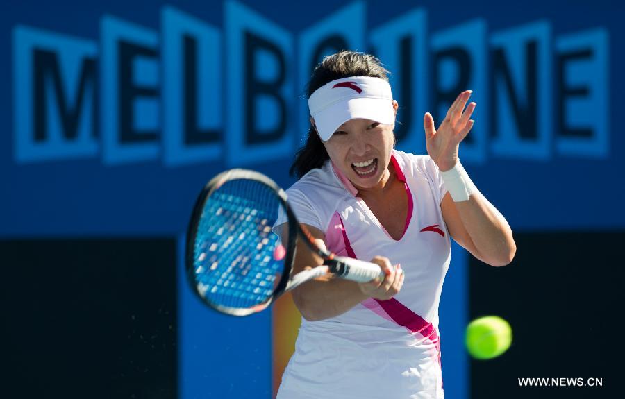 Zheng Jie of China hits a return during her first round women's singles match against Zhang Yuxuan of China on the first day of 2013 Australian Open tennis tournament in Melbourne, Australia, Jan. 14, 2013. Zheng Jie won 2-1. (Xinhua/Bai Xue) 