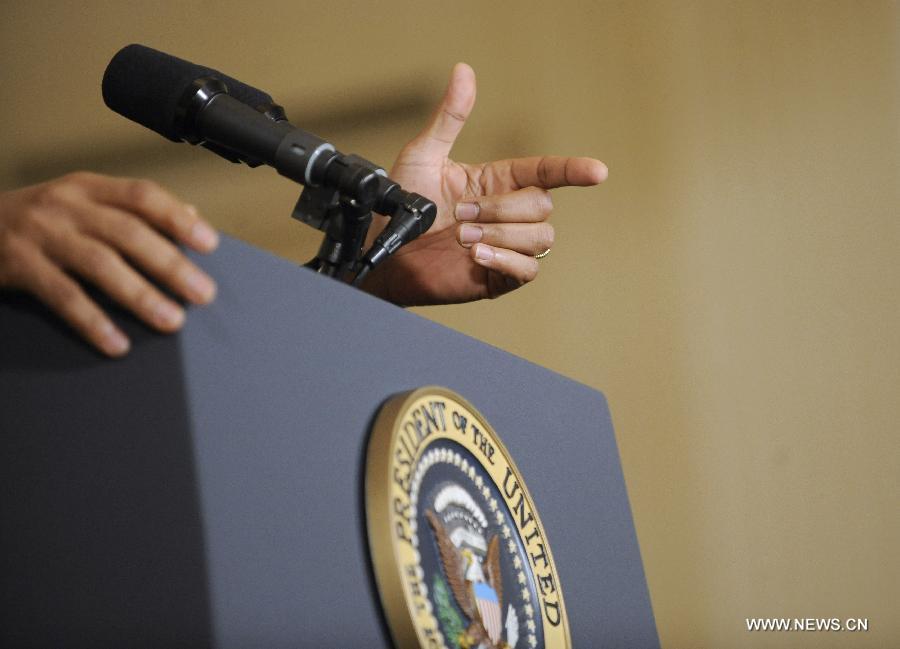 The hands of U.S. President Barack Obama are seen as he holds a press conference in the East Room of the White House in Washington D.C., capital of the United States, Jan. 14, 2013. The United States is making progress in enhancing its fiscal sustainability in the past years as a result of government spending cuts and more government revenue, Obama said here on Monday. (Xinhua/Zhang Jun) 