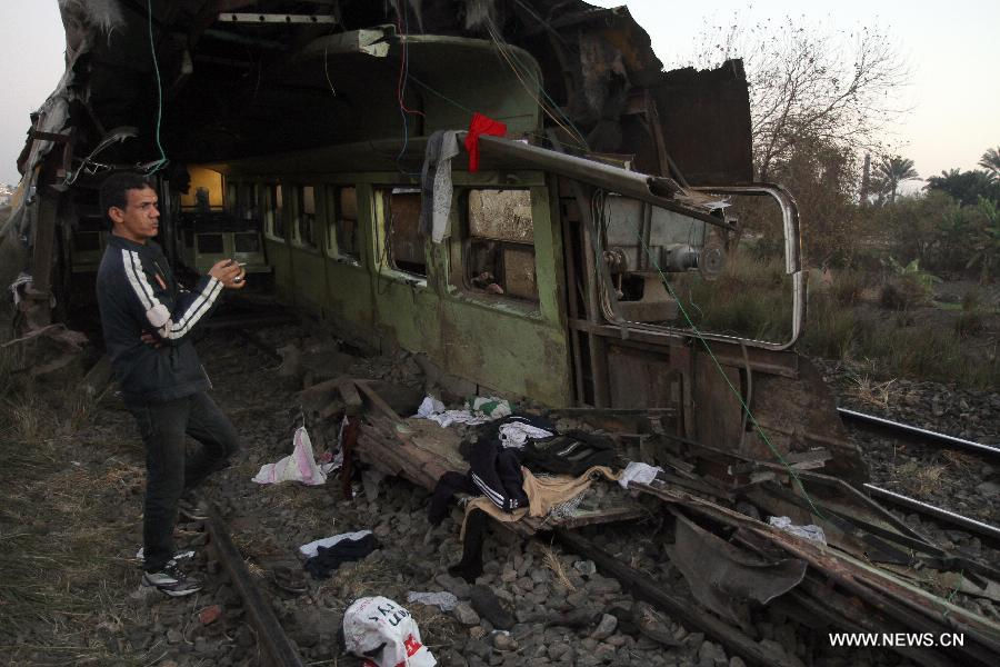 Photo taken on Jan. 15, 2013 shows the train derail accident site at the Giza neighborhoods of Badrashin, Egypt. A military train derailed in Egypt early Tuesday, killing at least 19 conscripts and injuring 107 others, a spokesman from the Health Ministry said in a statement to official MENA news agency. (Xinhua)