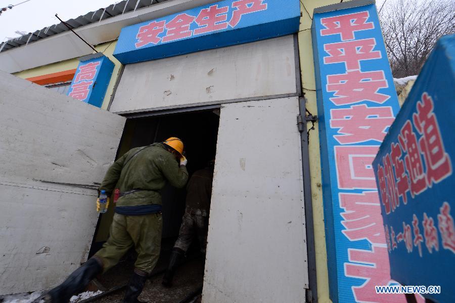 Workers prepare to help inspect the accident site at Laojinchang gold mine where an accident involving carbon monoxide poisoning happened, in Huadian, northeast China's Jilin Province, Jan. 15, 2013. Ten people were killed and 28 others injured when a fire broke out on early Tuesday morning inside the gold mine, resulting in a high density of carbon monoxide. An investigation into the cause of the accident is under way. (Xinhua/Lin Hong) 