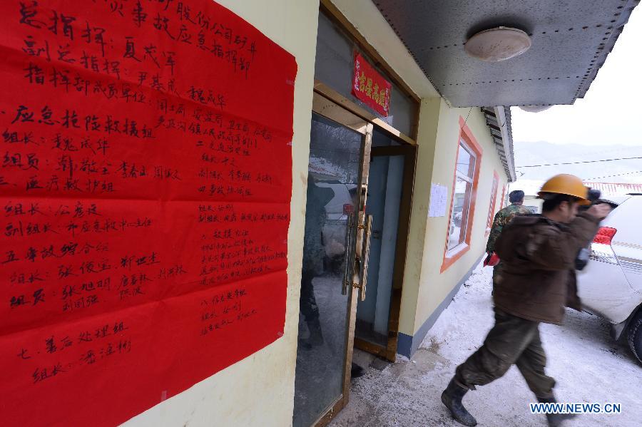 Photo taken on Jan. 15, 2013 shows a poster with people accountable for accident rescue at Laojinchang gold mine where an accident involving carbon monoxide poisoning happened, in Huadian, northeast China's Jilin Province. Ten people were killed and 28 others injured when a fire broke out on early Tuesday morning inside the gold mine, resulting in a high density of carbon monoxide. An investigation into the cause of the accident is under way. (Xinhua/Lin Hong) 