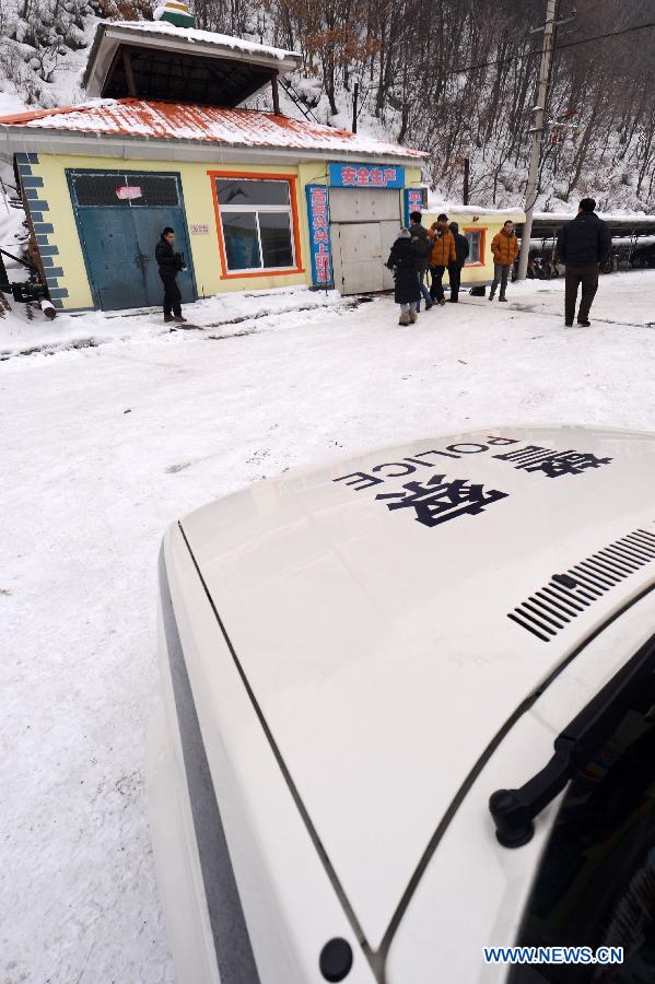 A police car is seen at Laojinchang gold mine where an accident involving carbon monoxide poisoning happened, in Huadian, northeast China's Jilin Province, Jan. 15, 2013. Ten people were killed and 28 others injured when a fire broke out on early Tuesday morning inside the gold mine, resulting in a high density of carbon monoxide. An investigation into the cause of the accident is under way. (Xinhua/Lin Hong) 