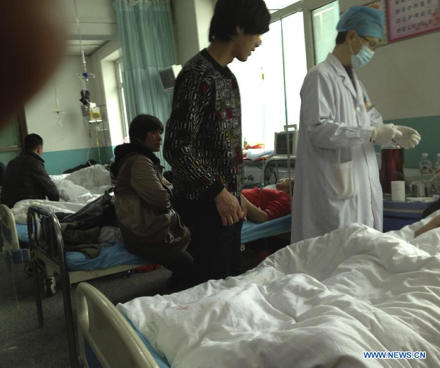 Victims of an accident involving carbon monoxide poisoning at a gold mine receive medical treatment at Renmin Hospital in Huadian City, northeast China's Jilin Province, Jan. 15, 2013. Ten people were killed and 28 others injured when a fire broke out on early Tuesday morning inside the Laojinchang gold mine, resulting in a high density of carbon monoxide. An investigation into the cause of the accident is under way. (Xinhua)